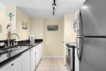 Fully equipped kitchen with dishwasher, microwave, and coffee maker 